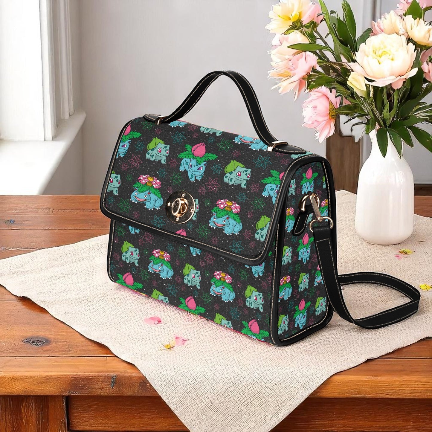 Gaming inspired handbag with grass-type creature print - structured bag with nostalgic character design